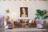 Platinum Swirl Barbie painting titled White Ginger by artist Judy Ragagli hangs above a brown leather couch.