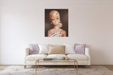 White Ginger vintage Barbie oil painting hangs above a creme sofa.